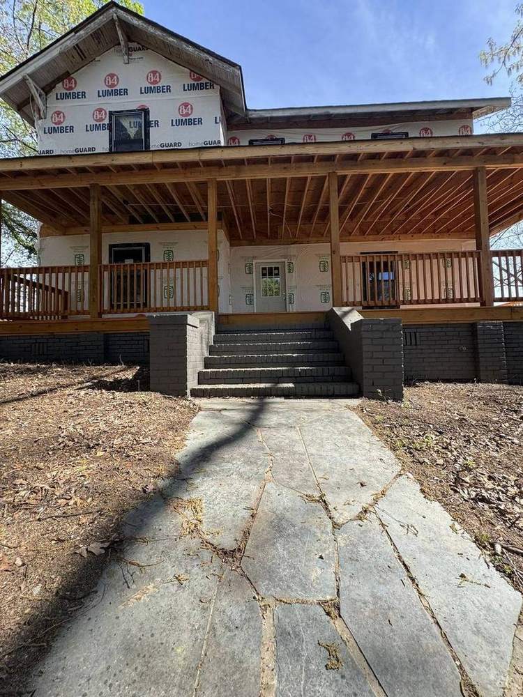 Rebuilt front porch with new railing and steps