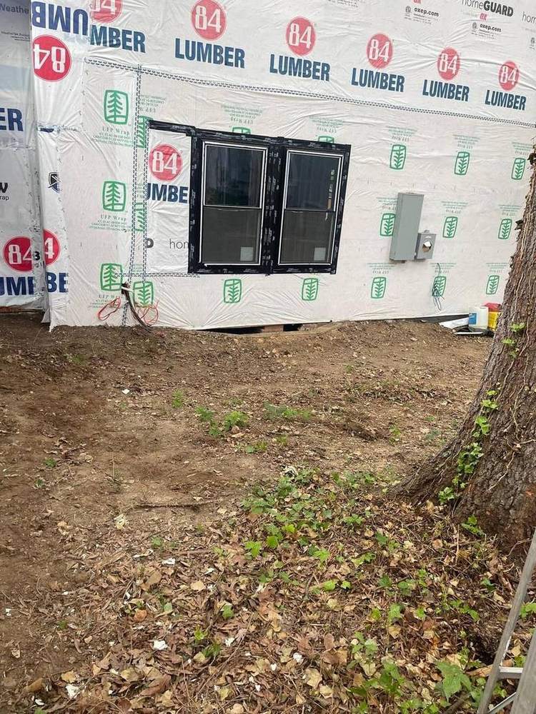 Exterior with new house wrap and windows