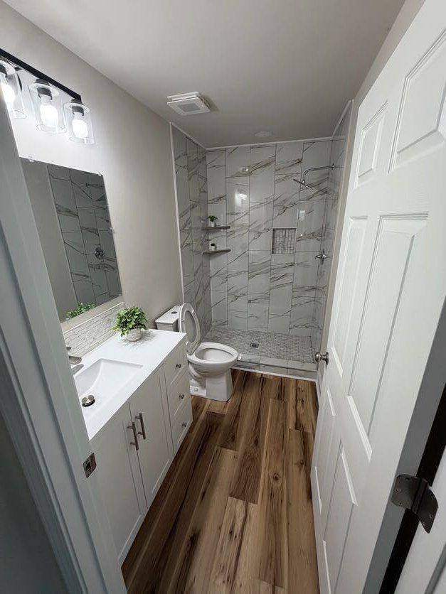 Full bath with tiled walk-in shower