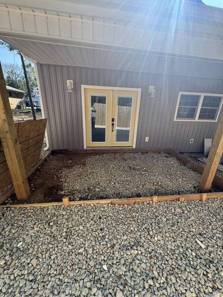 French doors and gravel patio at the entry