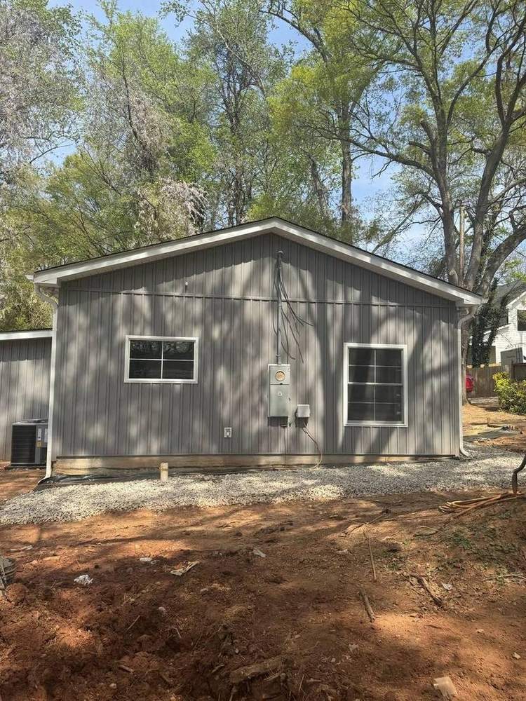 Converted garage in Belmont with gray siding