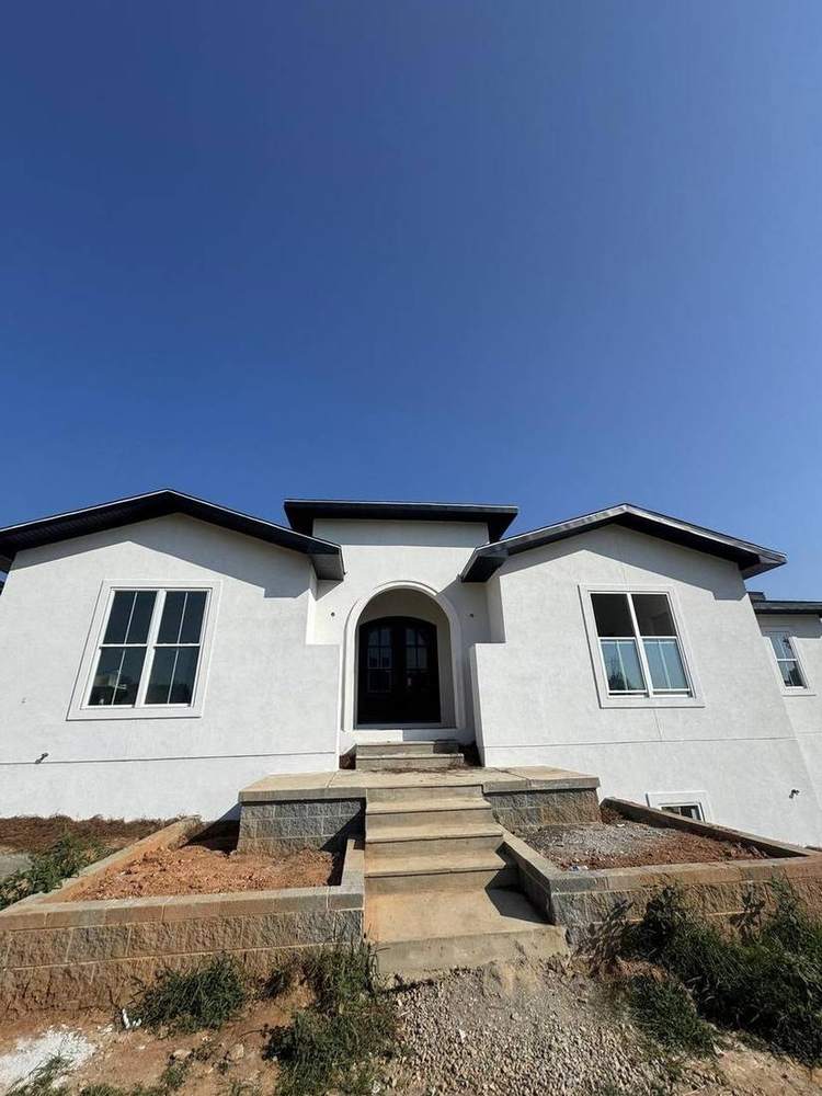 Finished stucco on the front elevation