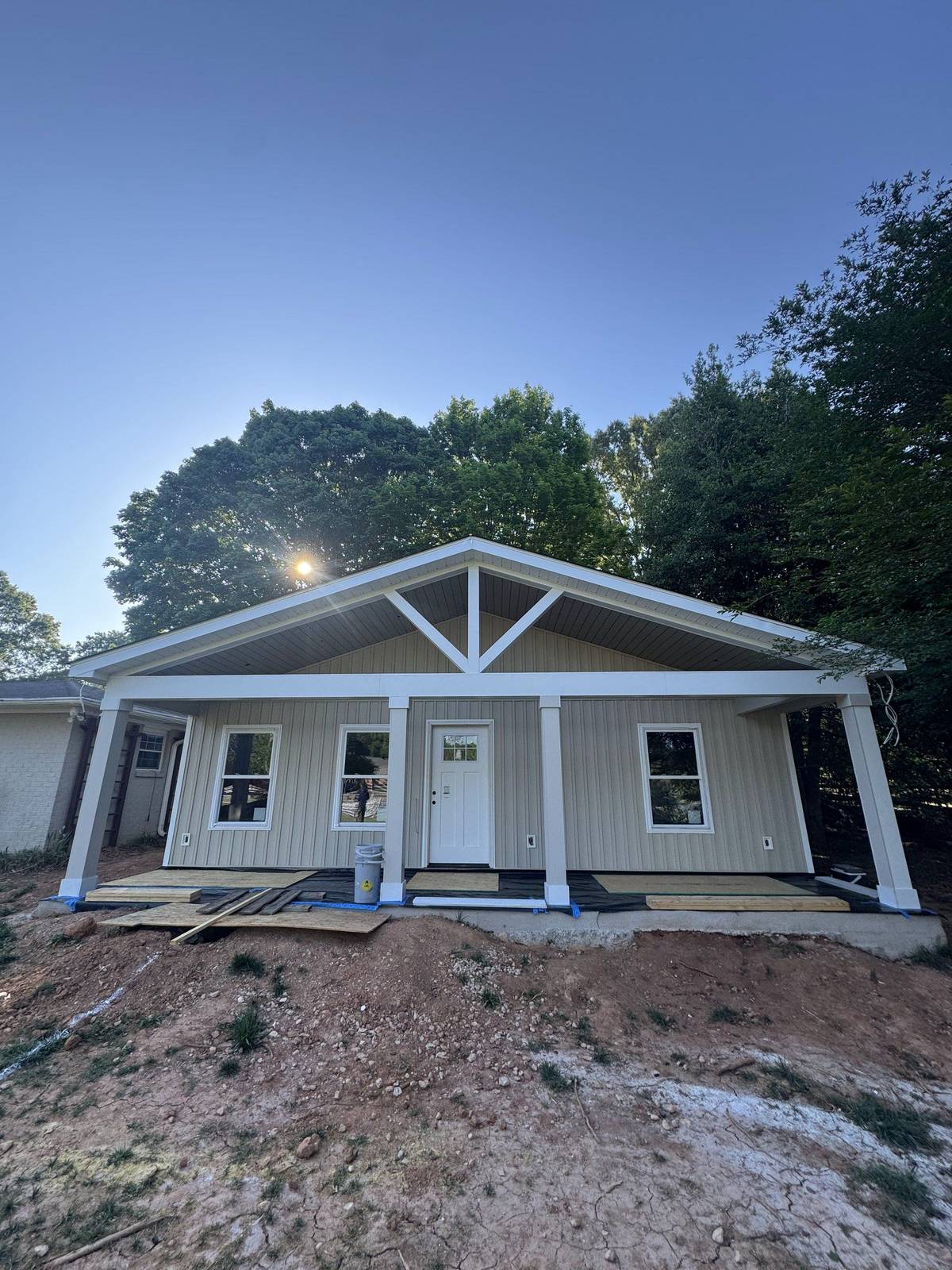 Finished detached ADU built by J&I Custom Homes in Mint Hill, NC, with board-and-batten siding and a covered porch