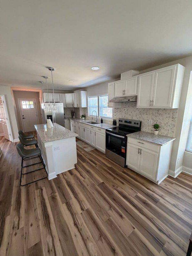 Kitchen island with granite top and seating
