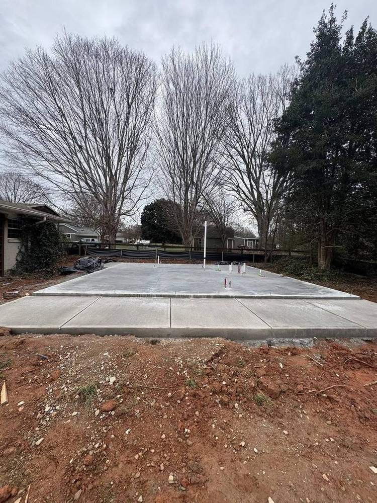 Poured concrete slab with plumbing stub-ups