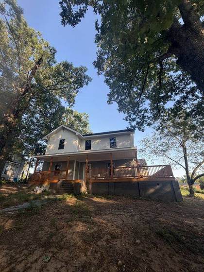 The house now, with new siding, roof and porch