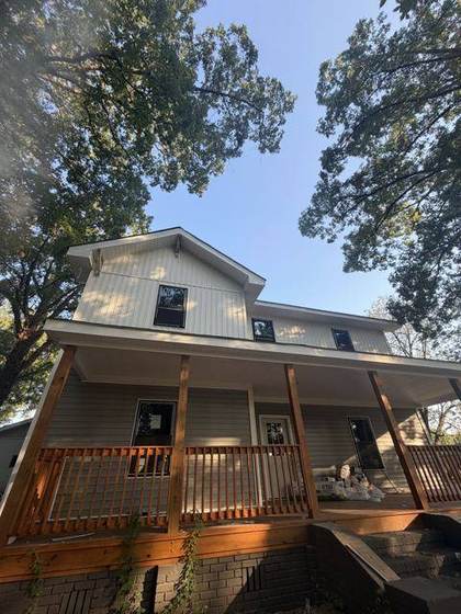The finished porch with new deck, columns and railing
