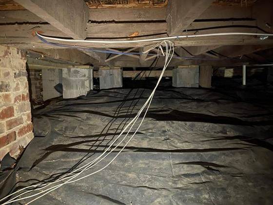 Crawl space with vapor barrier and new wiring
