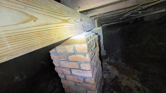 Original brick pier with the new beam above