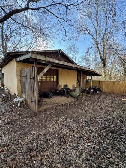 The carport side before