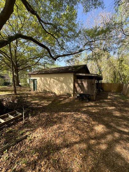 The garage before, with the lean-to carport