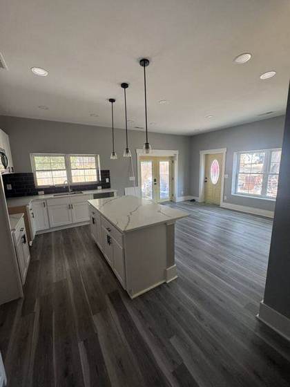 Kitchen with island and pendant lights