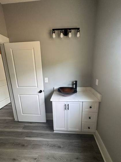 Bath vanity with vessel sink