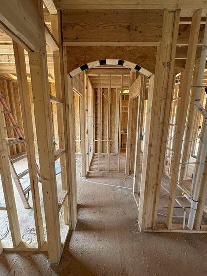 Arched interior openings framed by hand