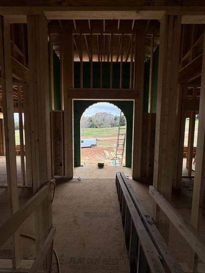 Arched front entry framed, seen from inside