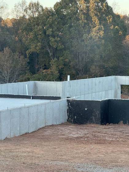 Poured concrete foundation walls with waterproofing