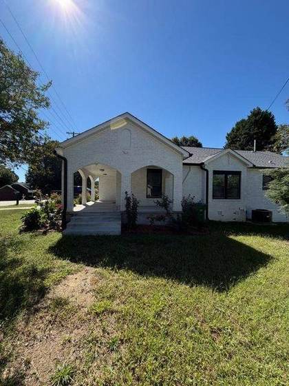 Front elevation with arched porch