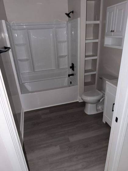 Finished bathroom with tub and shower