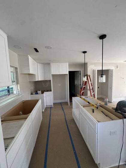 Kitchen cabinets and island being installed