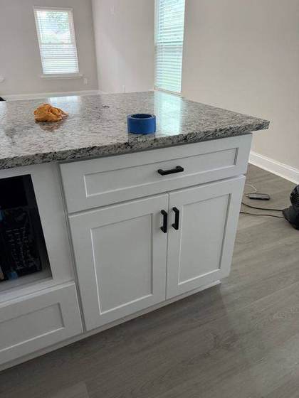 Granite island with shaker cabinets