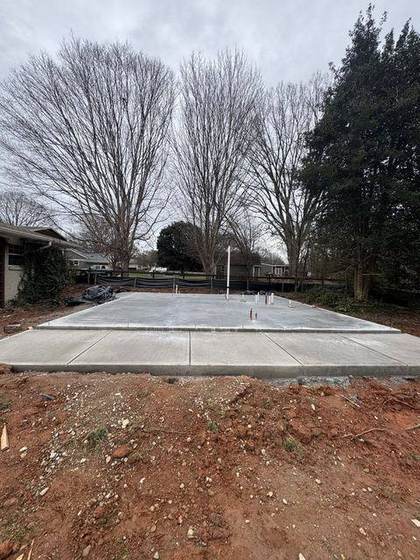 Finished concrete slab with plumbing stub-ups