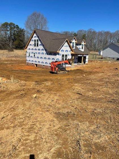 Grading around the framed home