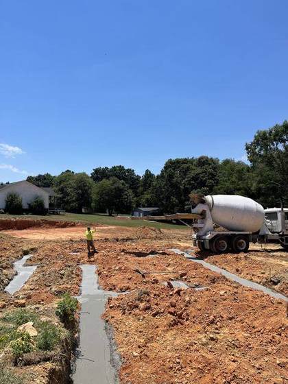 Concrete truck pouring the footings
