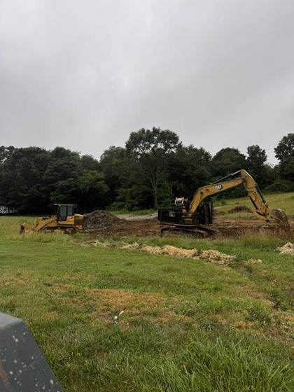Excavator clearing the lot